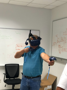 A K-12 teacher experiencing Virtual Reality application developed by the ECU NSF RED project team.